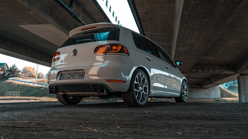 silver bmw m 3 coupe parked on gray concrete pavement