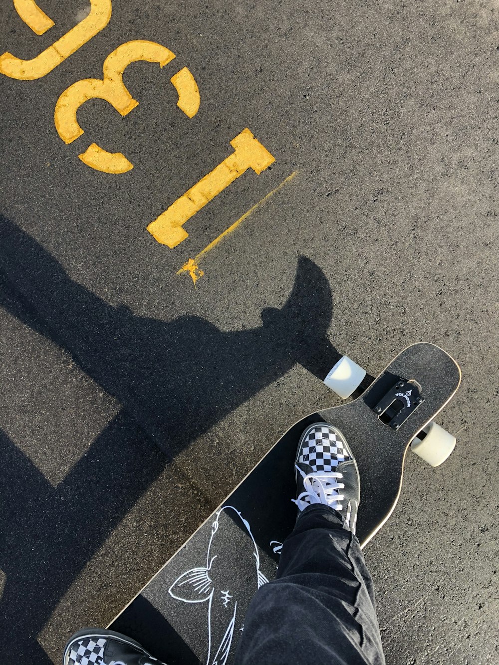 person in black and white sneakers