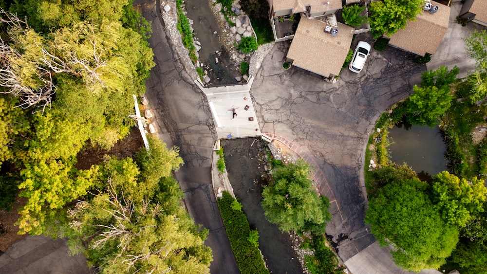 aerial view of green trees and gray concrete building