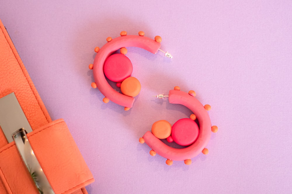 pink and orange balloons on white wall