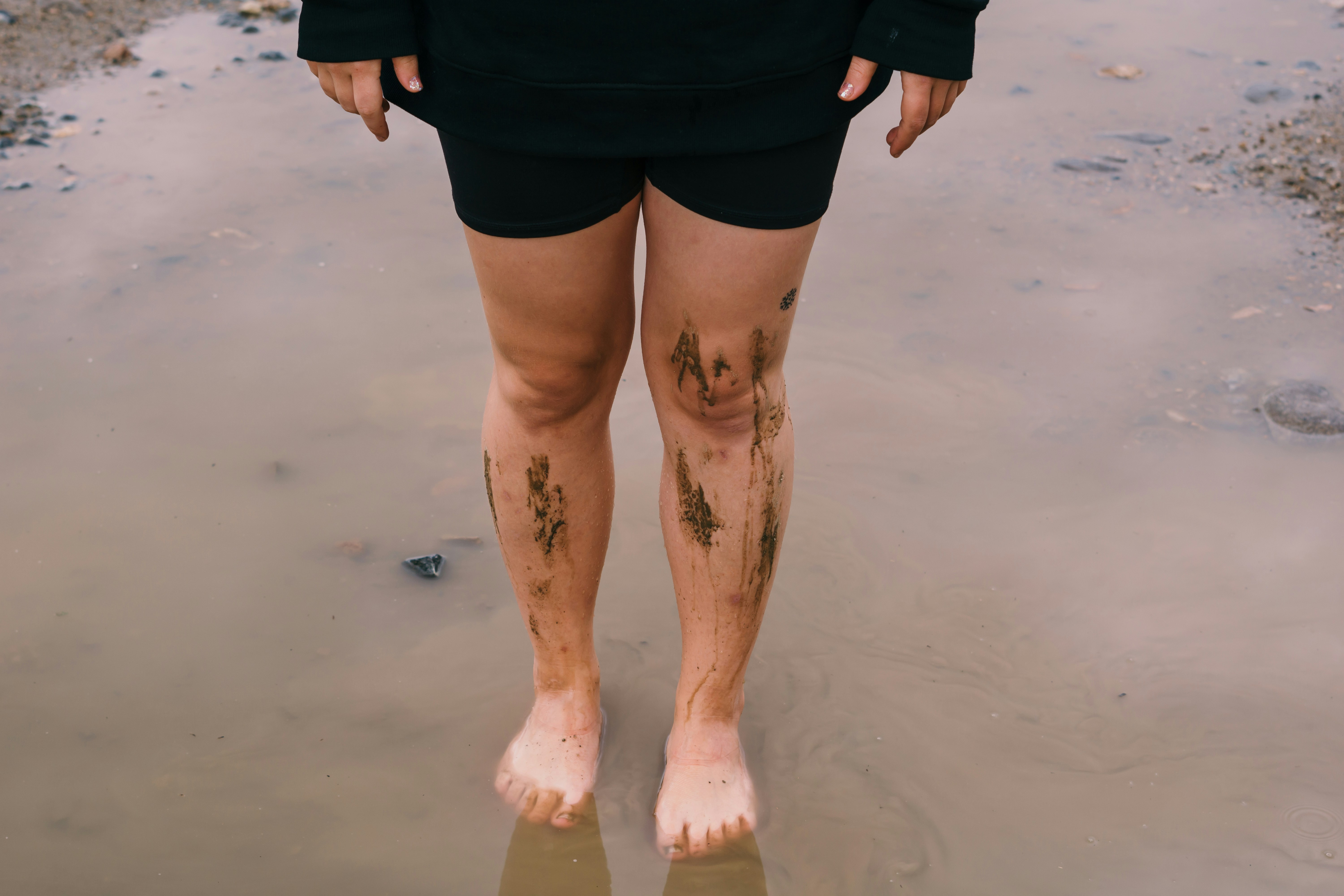 person in black shorts with skin tattoo