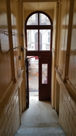 Wide shot of a hallway featuring tall, classic baseboards with detailed molding.