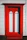 Front view of a colorful modern wooden door installed on a sunny suburban home.