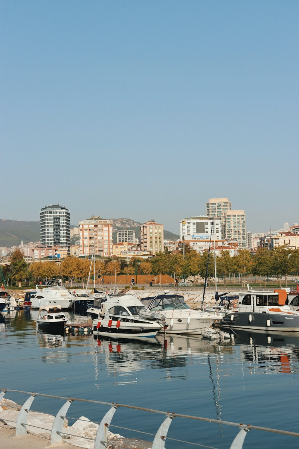 white and black boat on body of water during daytime