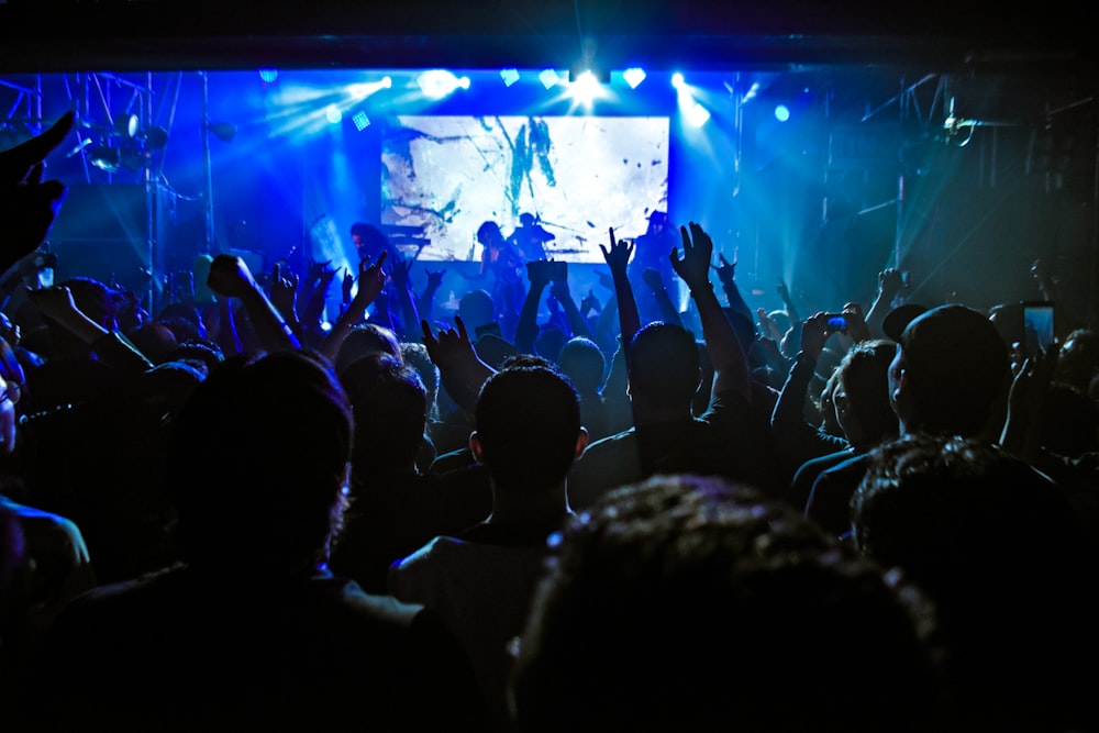 people watching concert during night time