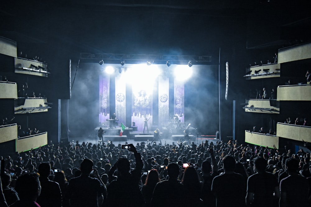 people watching concert during nighttime