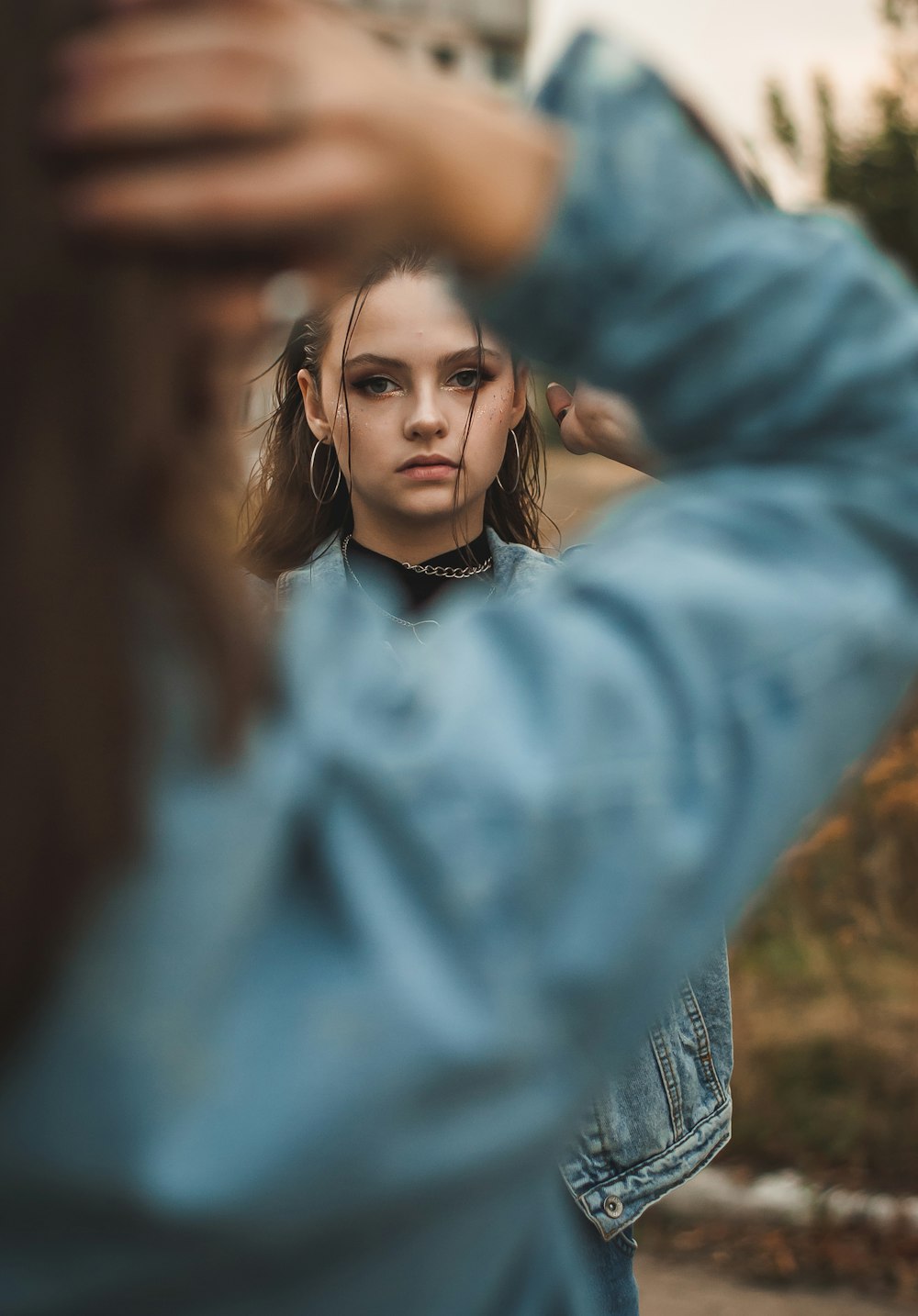 woman in blue long sleeve shirt