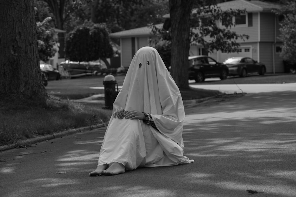 grayscale photo of woman in white hijab