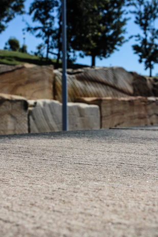 Close-up of a freshly cast concrete pole showing texture and strength details.