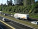 Cargo trucks transporting vehicles on a highway