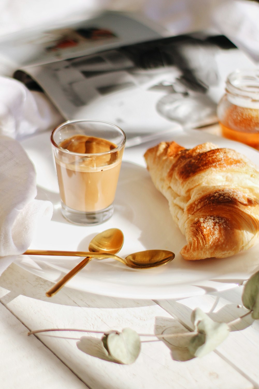 bread on white paper towel beside stainless steel spoon