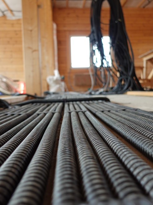 Industrial cable glands displayed in a warehouse setting.