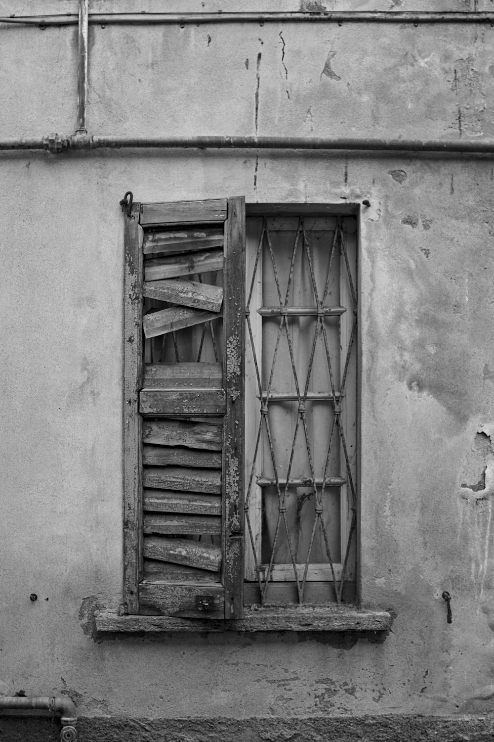 grayscale photo of wooden door