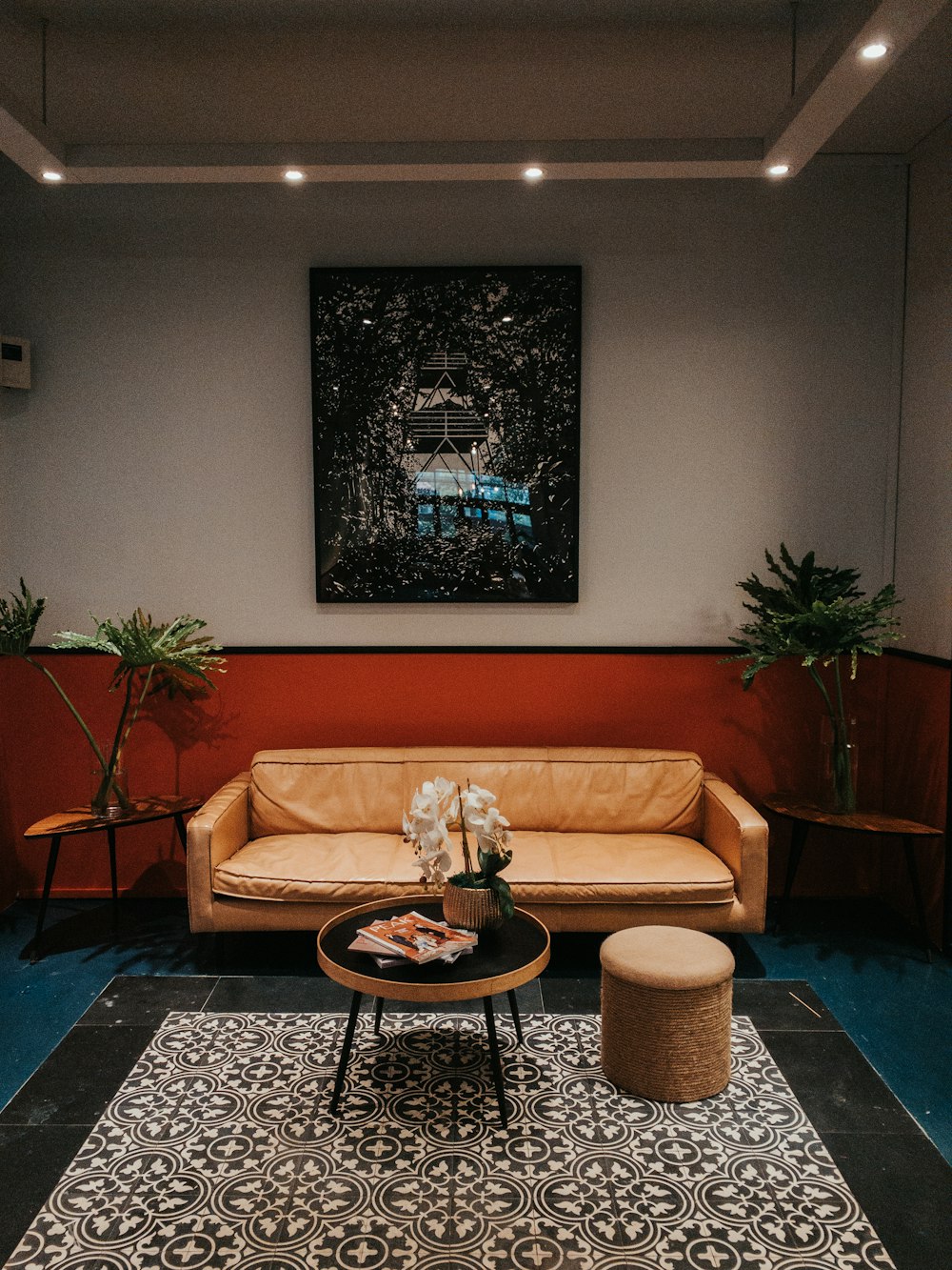 brown sofa chair near black round table