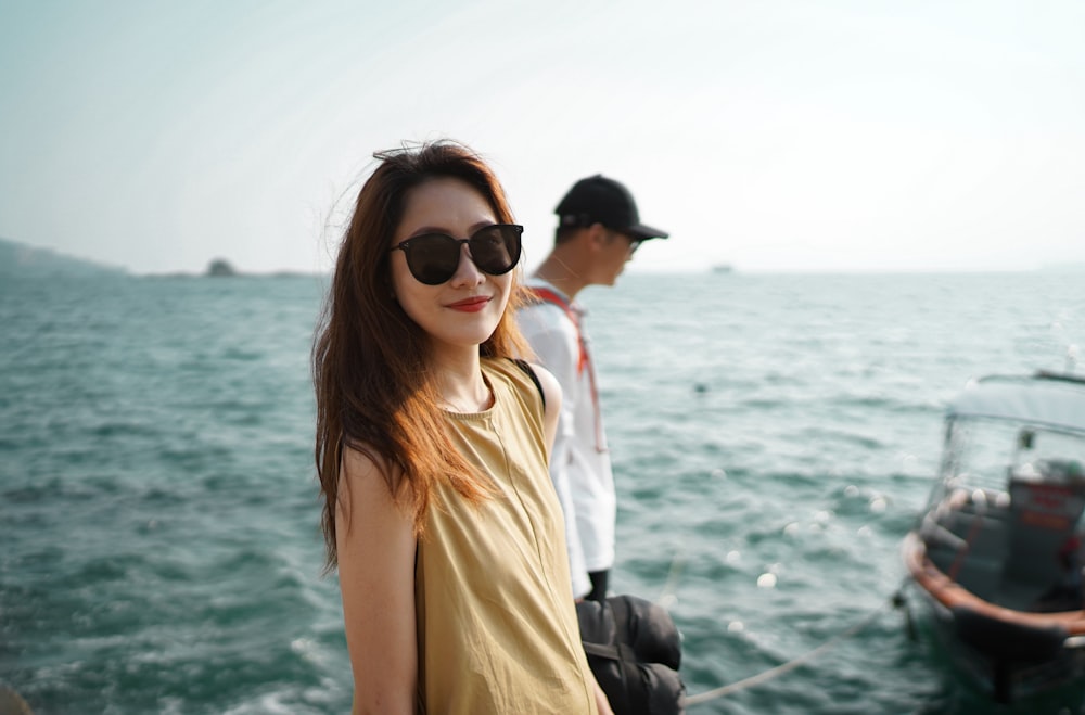 woman in white tank top and black sunglasses