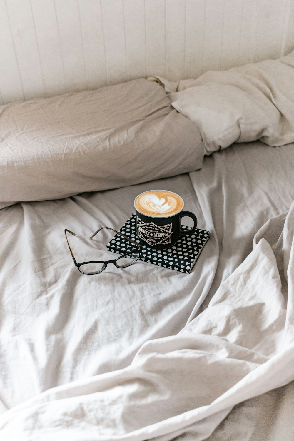 black and white polka dot ceramic mug on black and white polka dot ceramic saucer