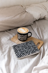 black and white polka dot ceramic mug on black and white book