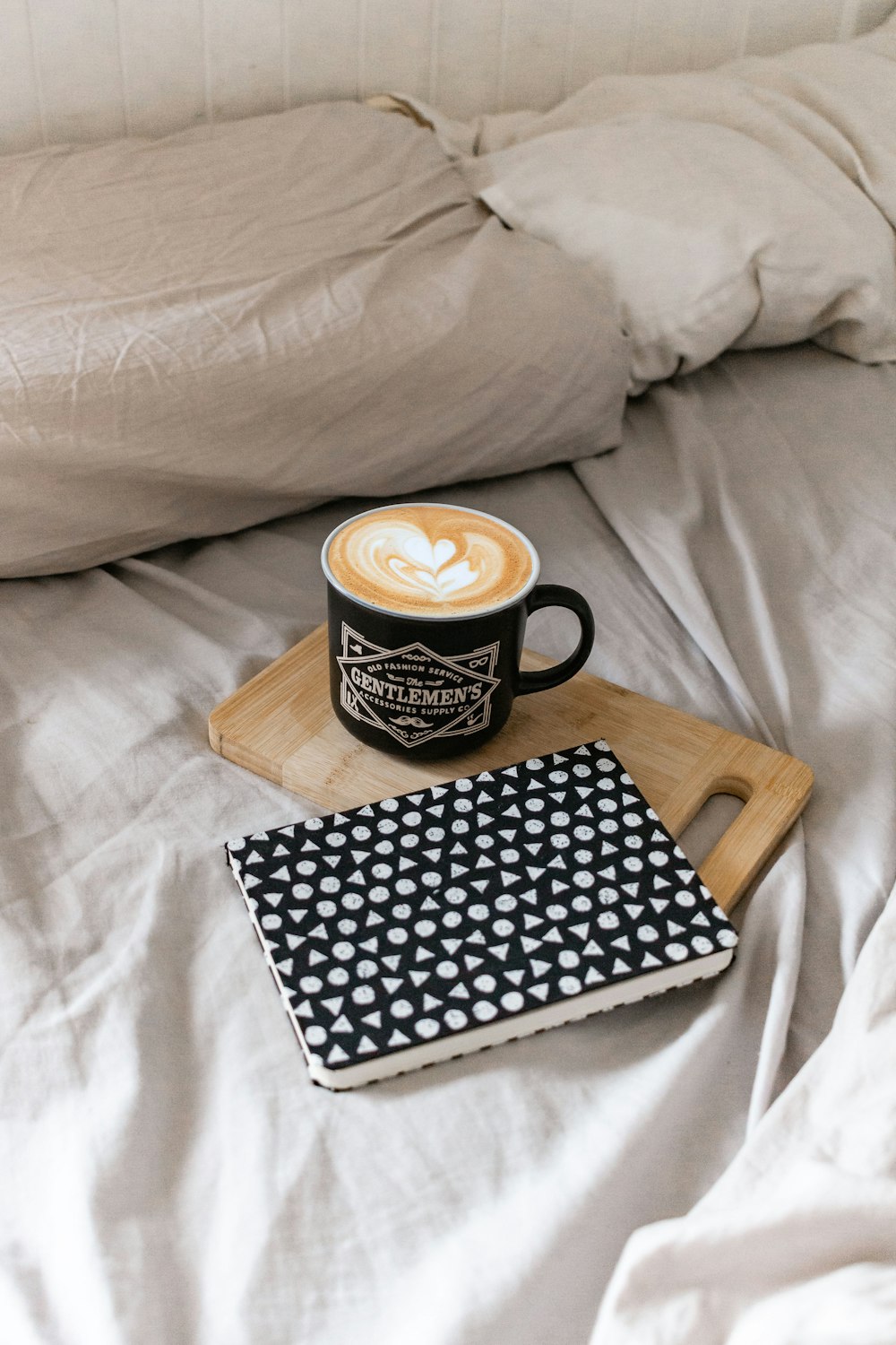 black and white polka dot ceramic mug on black and white book