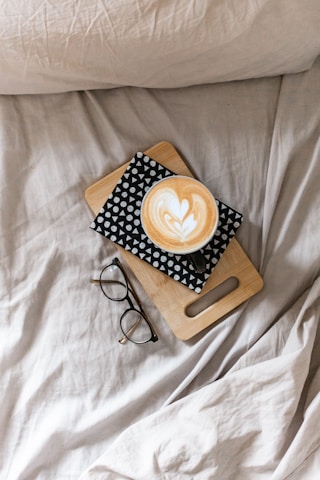 Cozy journal and tea on a blanket—symbolizing a gentle reset from strict diets