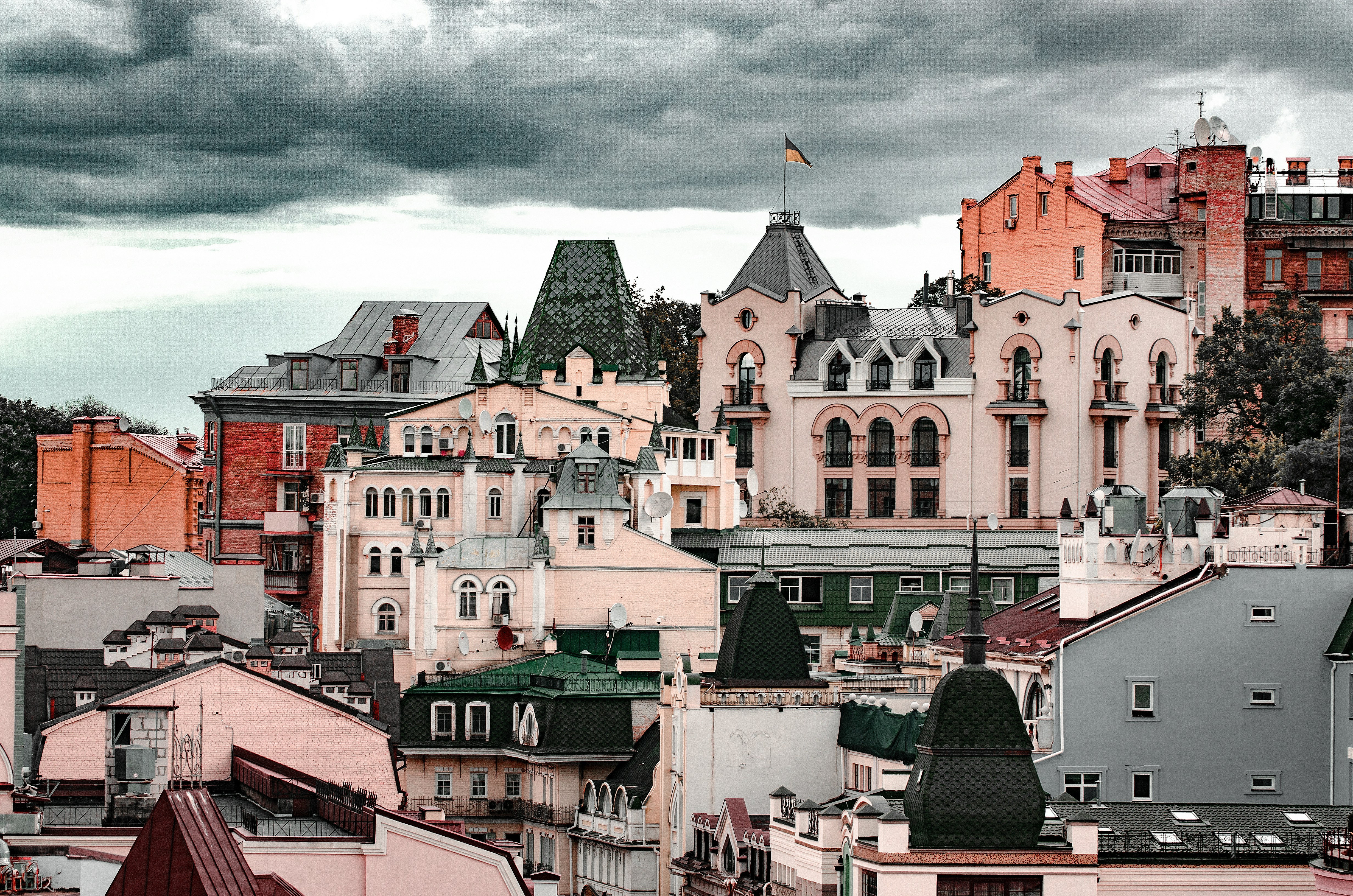 red and white concrete buildings under cloudy sky during daytime