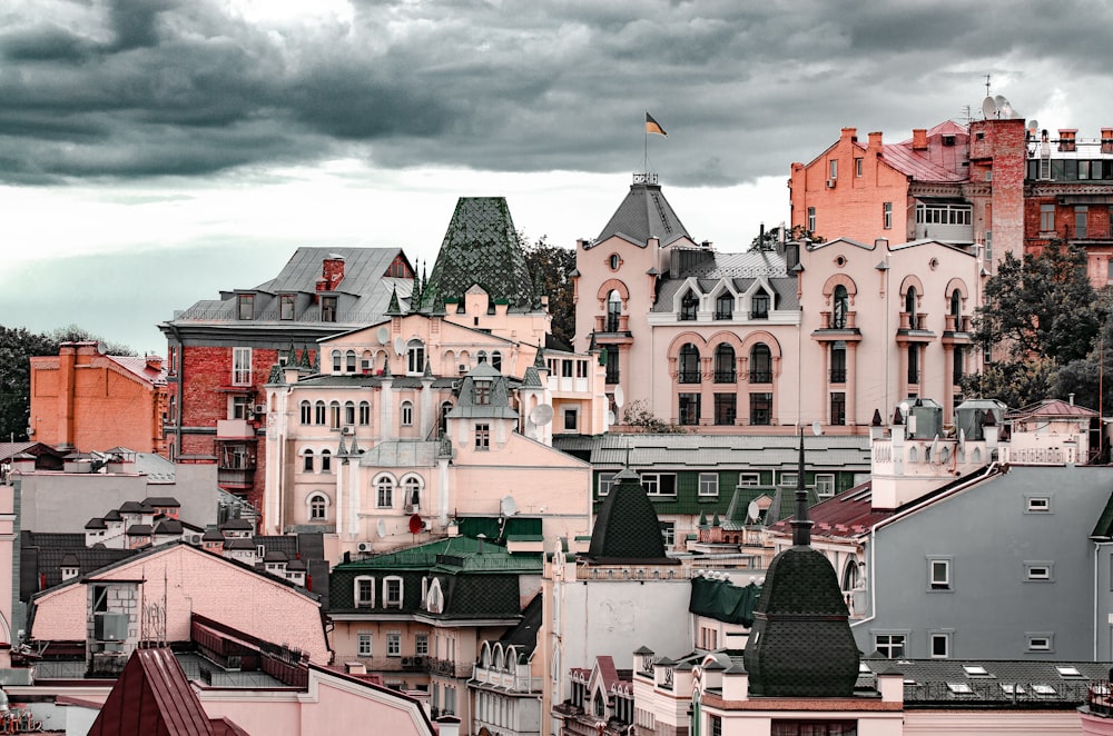 red and white concrete buildings under cloudy sky during daytime