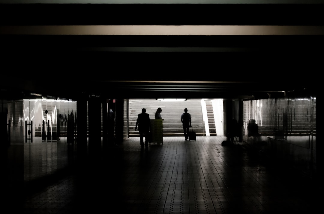 silhouette of people walking on hallway