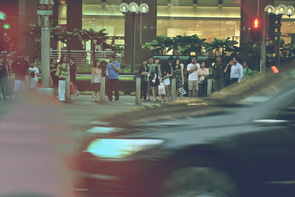 people standing near building during night time