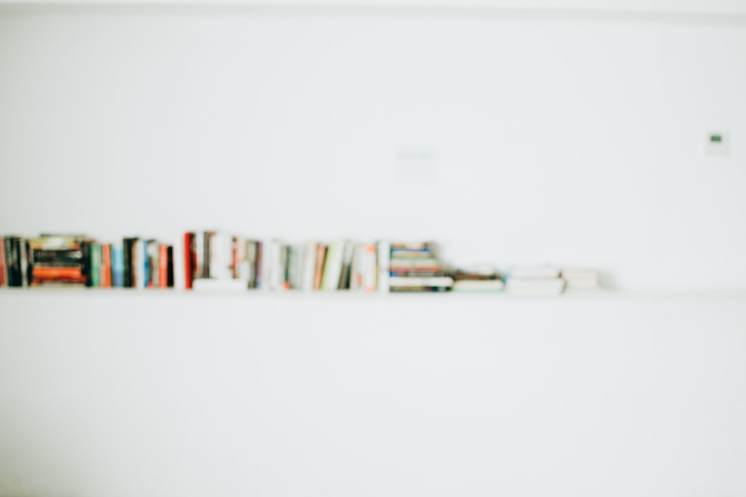 white wooden book shelf with books