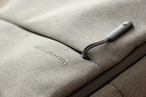 Close-up of a durable, zippered storage bag filled with winter clothes