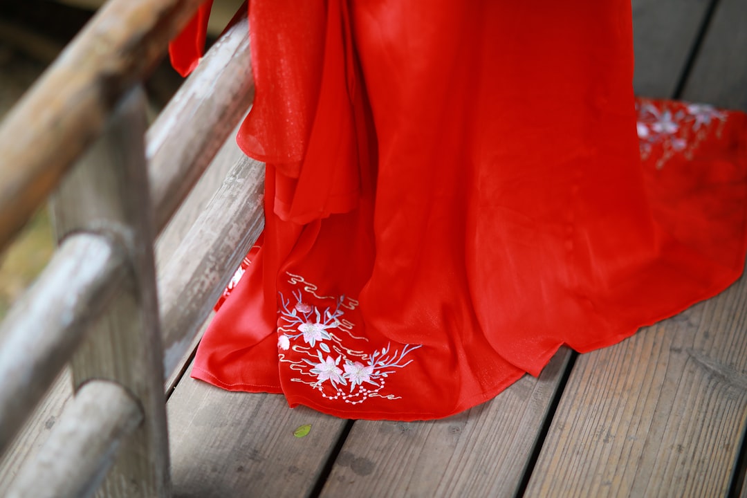 Traditional Chinese bride wearing a red qipao dress, demonstrating how red features in major life celebrations