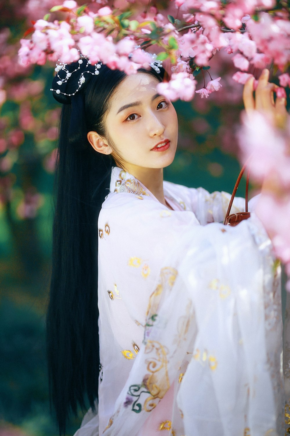 woman in white and yellow floral dress