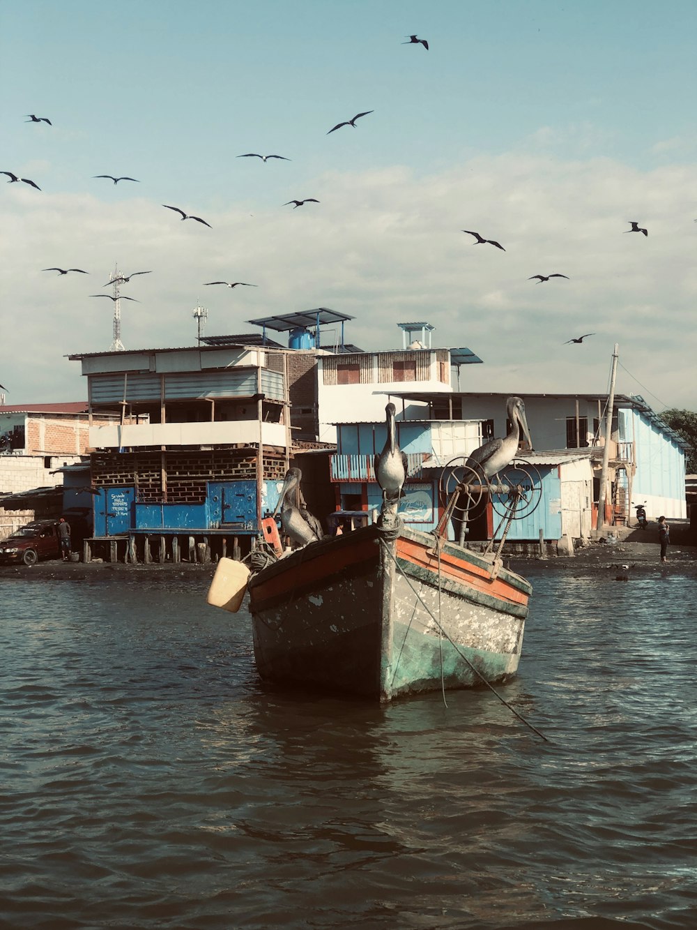 blue and brown boat on water during daytime