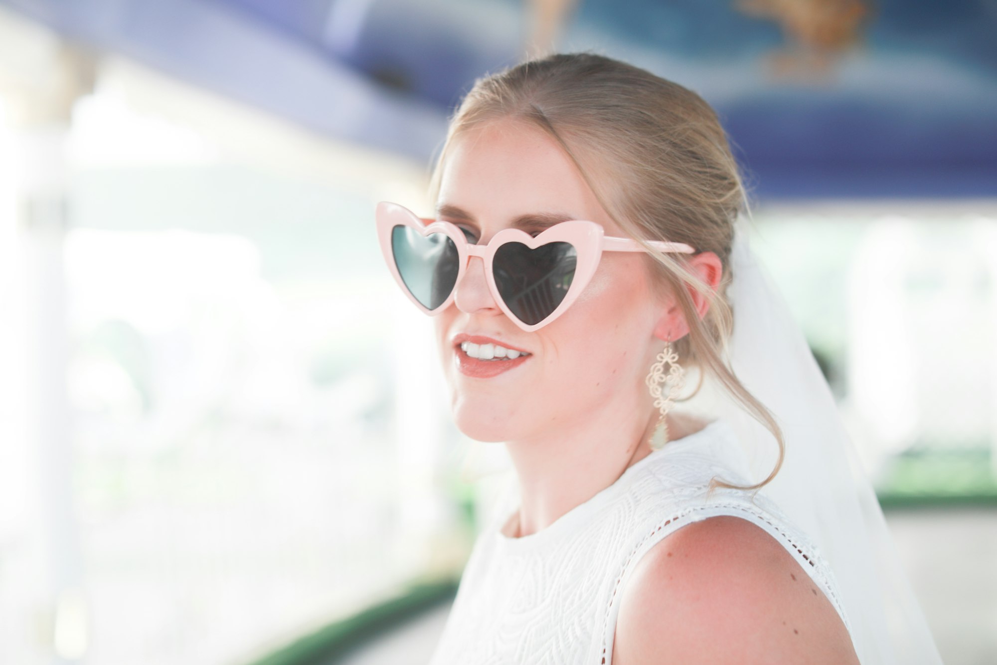 Young, fun bride with heart sunglasses getting married in Las Vegas Nevada. 