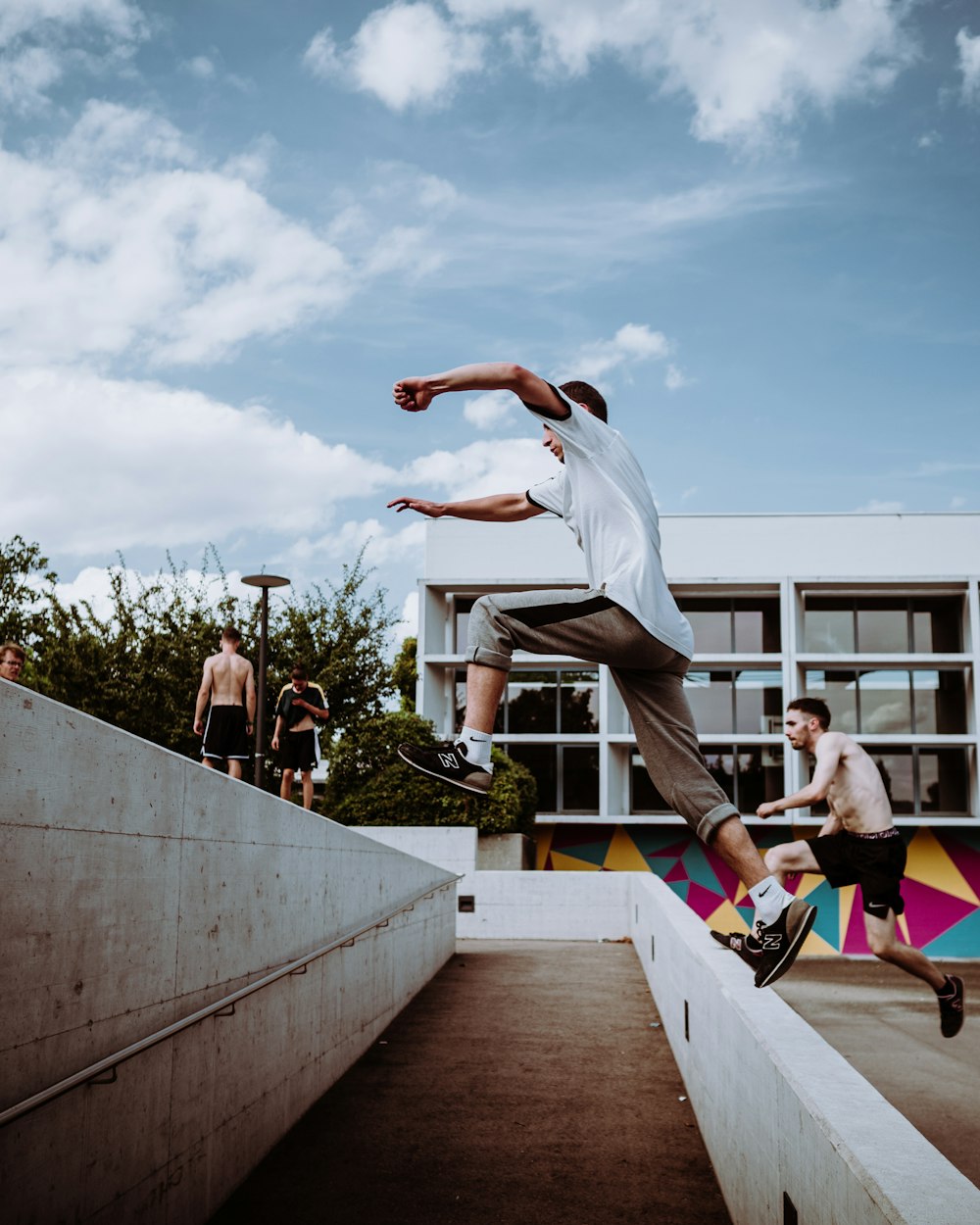 people doing yoga on gray concrete floor during daytime