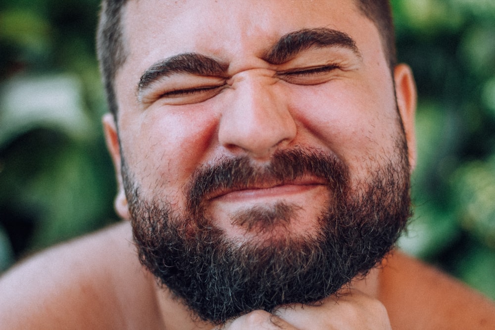 man with black beard wearing black frame eyeglasses