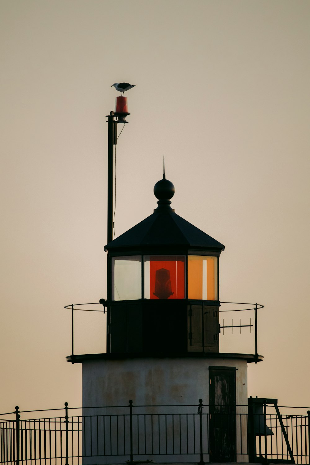 red and white tower under white sky