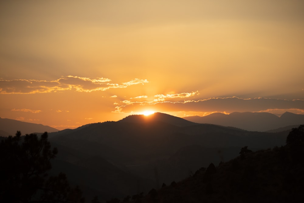 silhouette of mountains during sunset