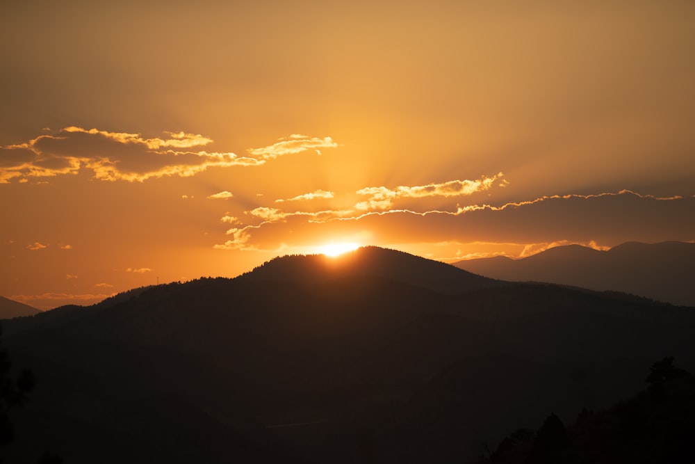 silhouette of mountain during sunset