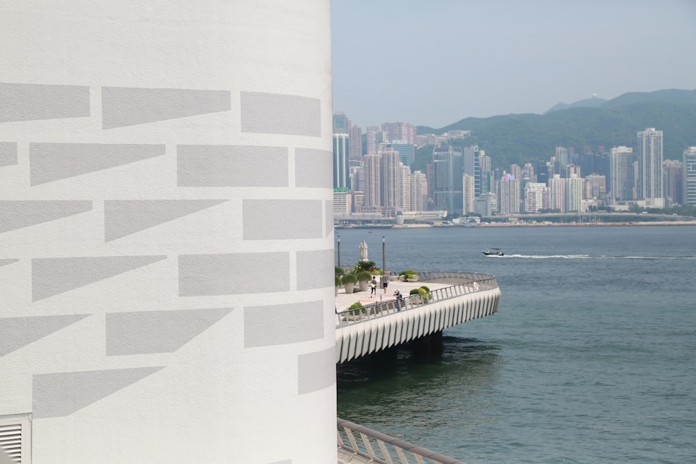 white concrete building near body of water during daytime