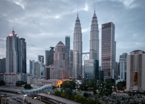 city buildings under white cloudy sky during daytime