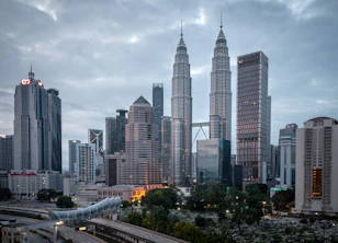 city buildings under white cloudy sky during daytime