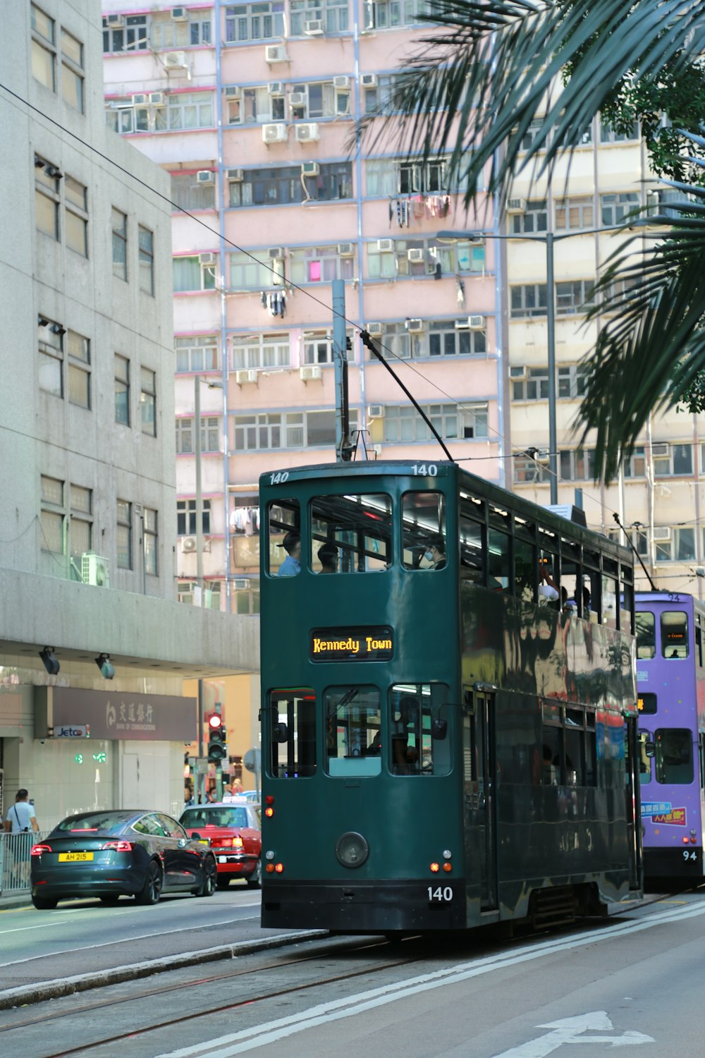 blue and red tram on road during daytime