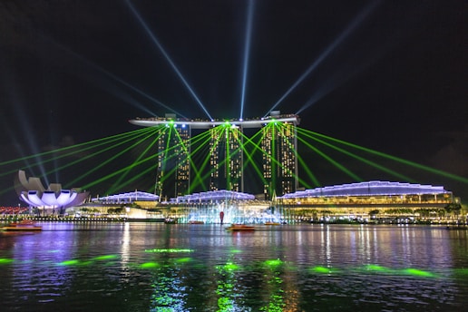 blue bridge over water during night time