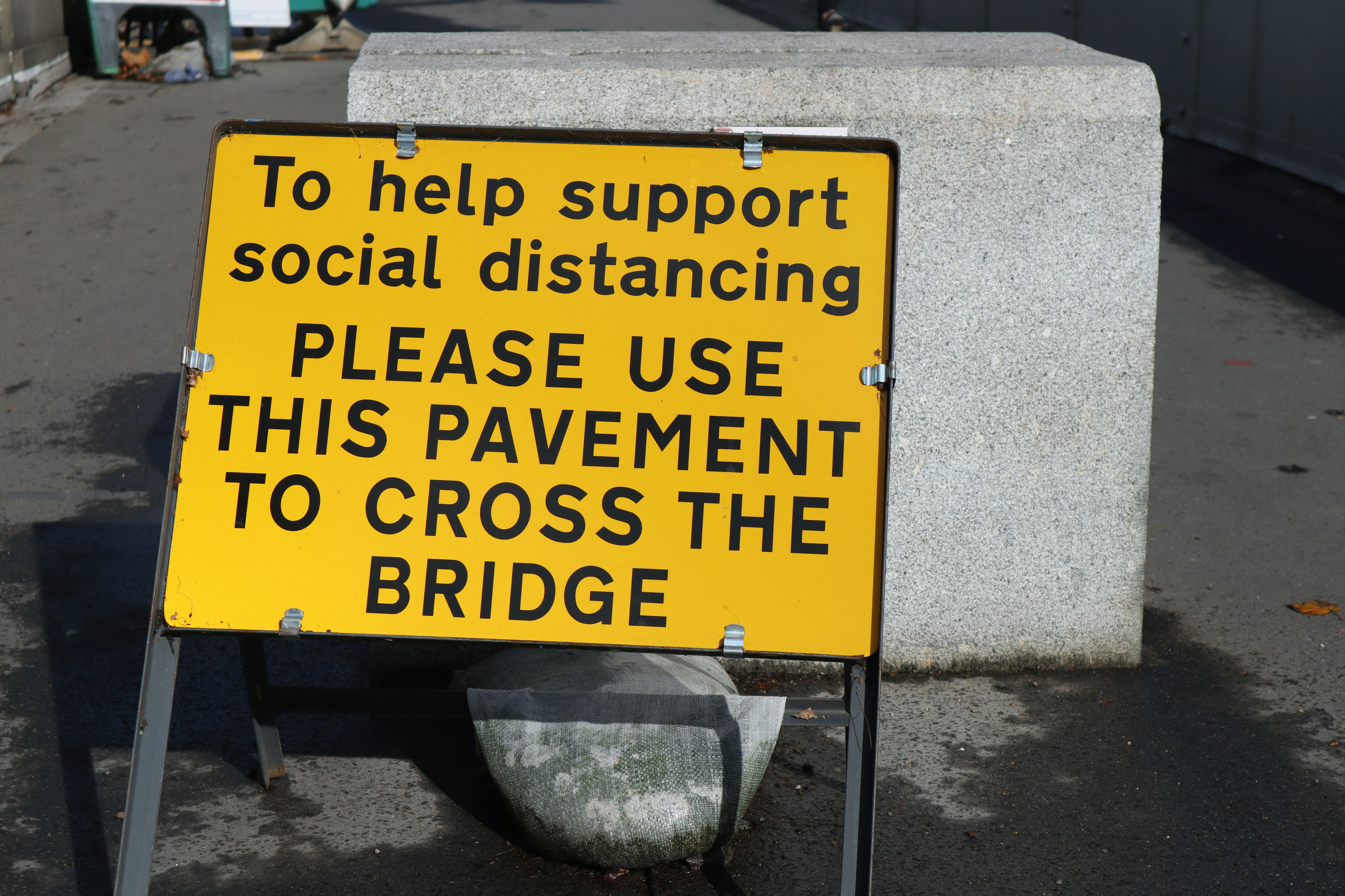 help support social distancing use the pavement to cross the bridge