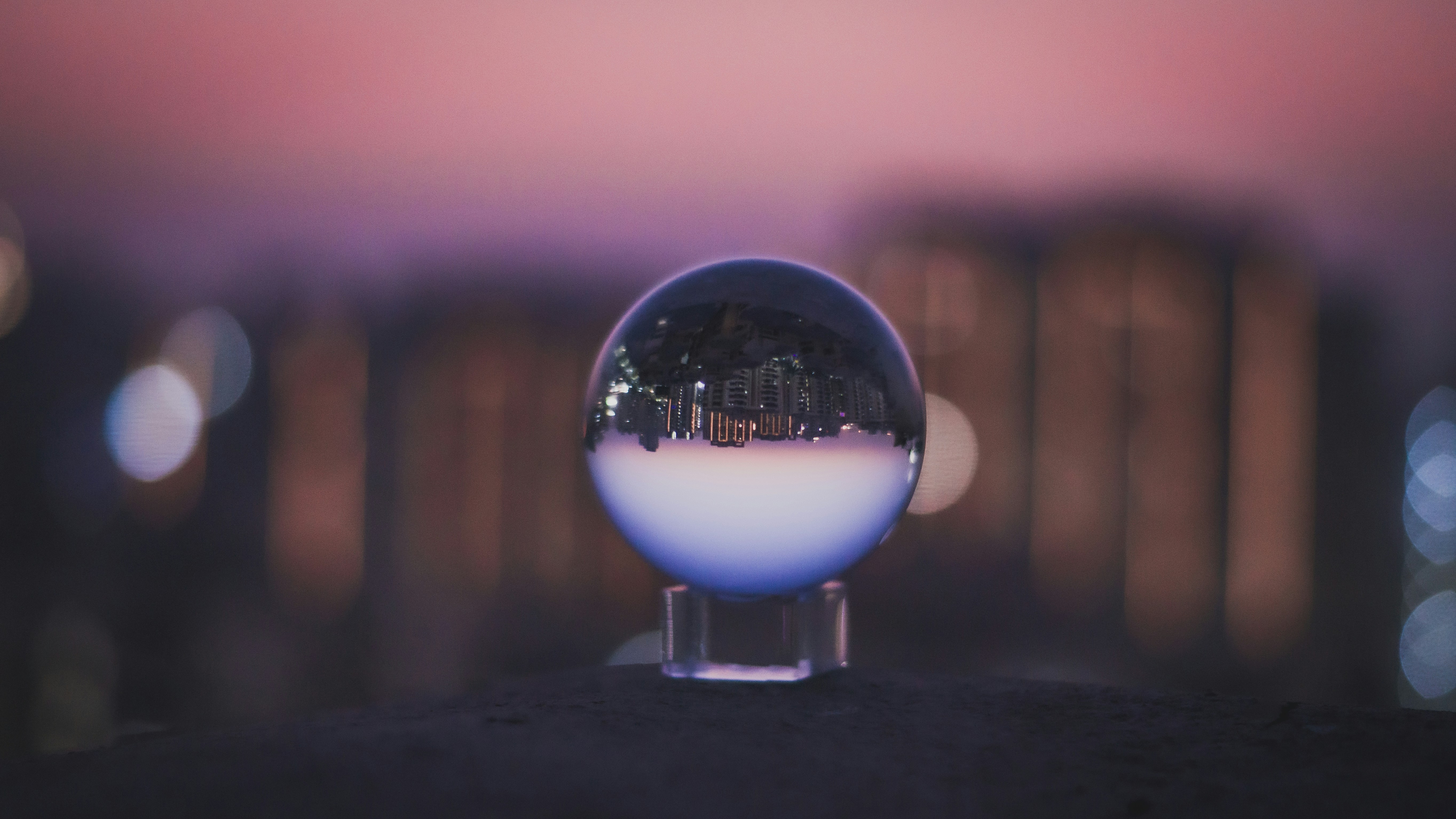 clear glass ball on black surface