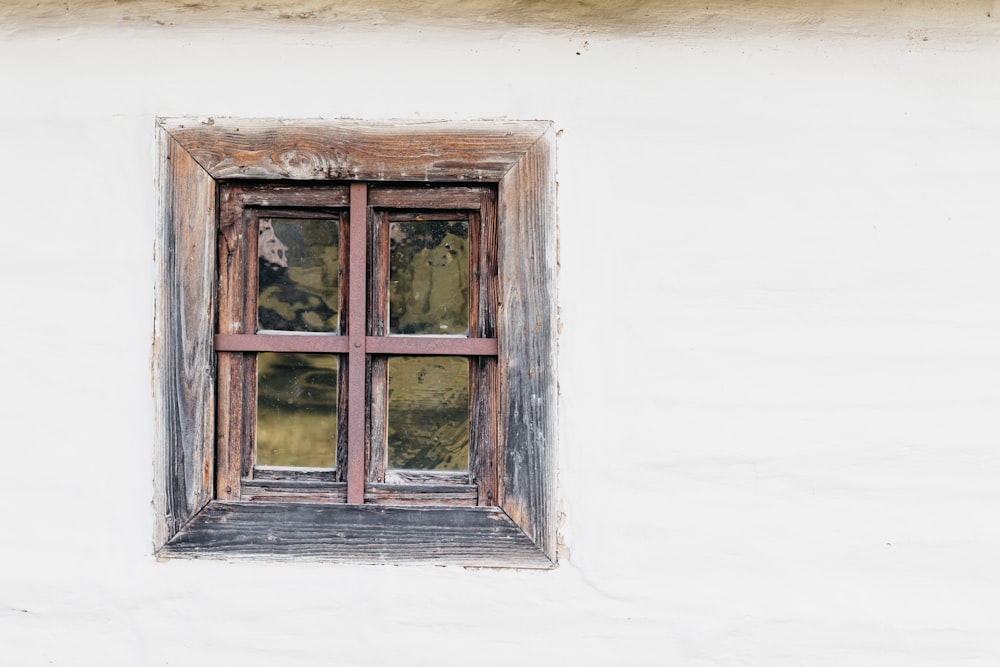 brown wooden framed glass window