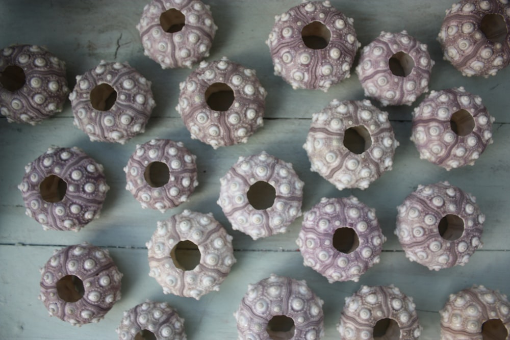 pink and white donuts on white paper