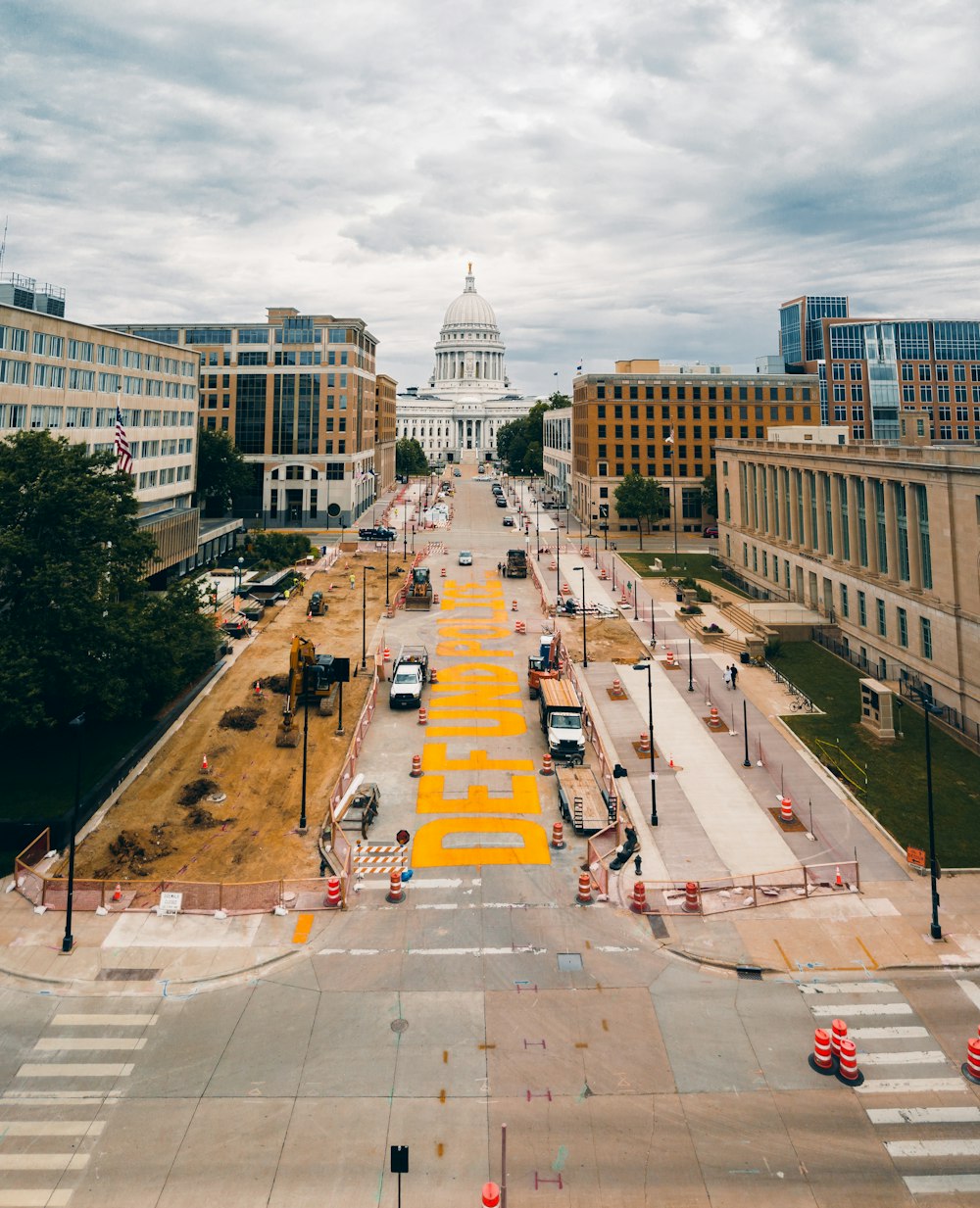 people walking on pedestrian lane near building during daytime