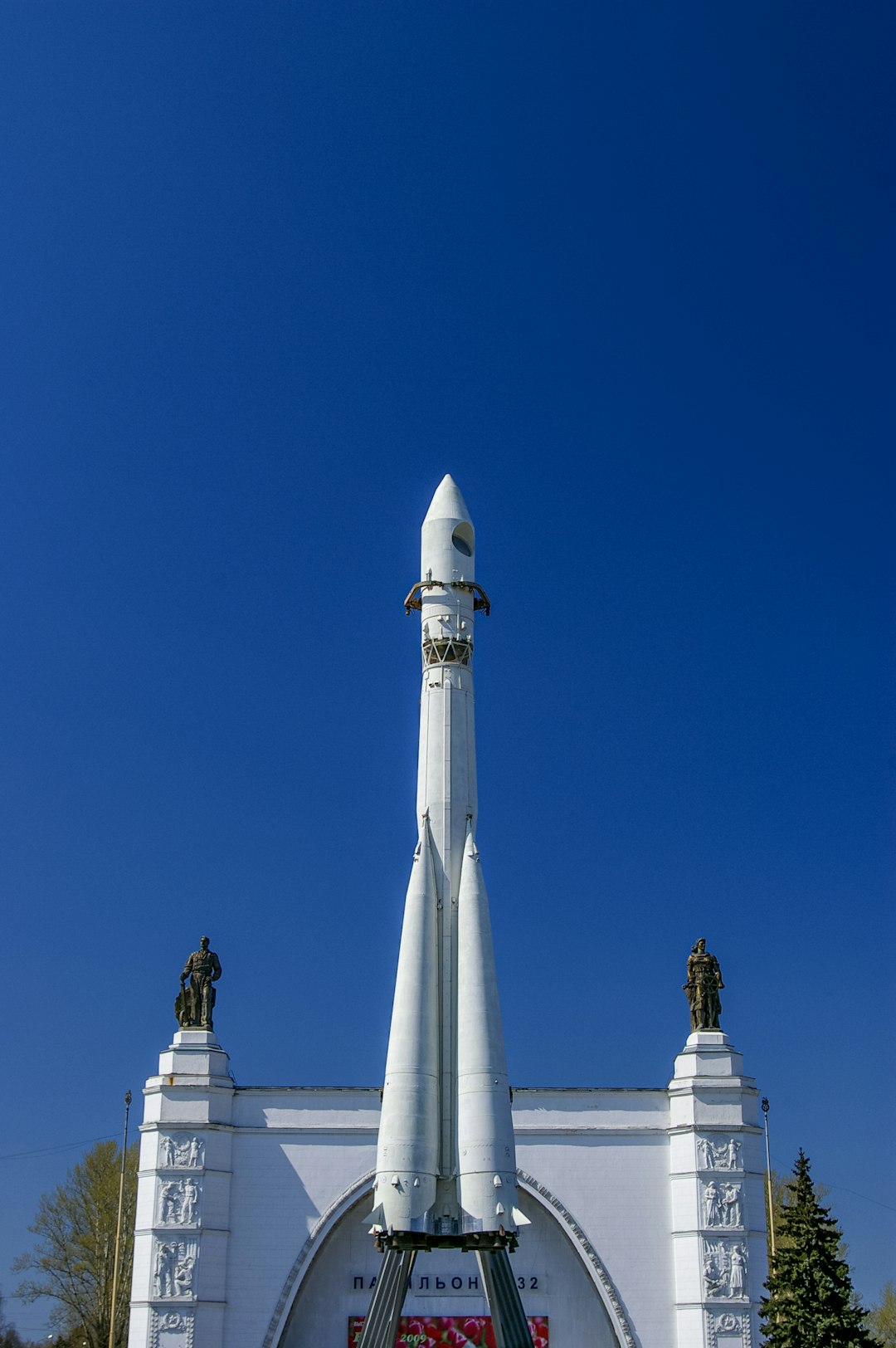 white and gray concrete tower under blue sky during daytime