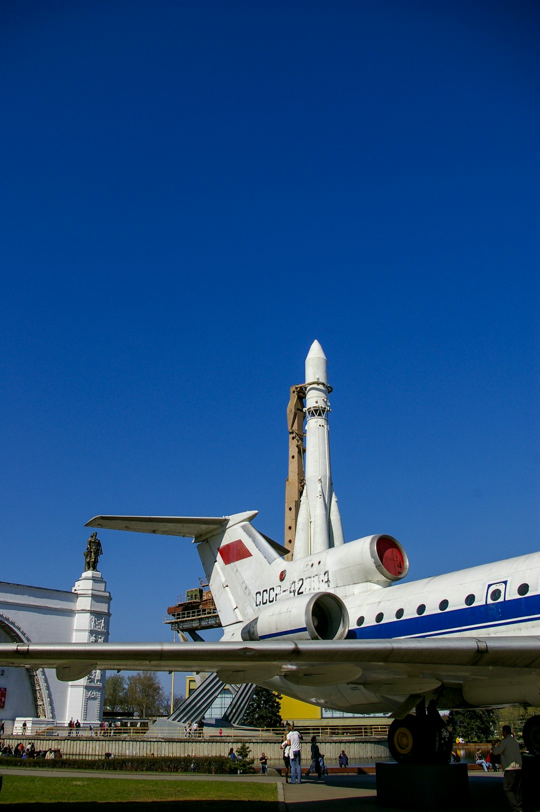 white and blue passenger plane under blue sky during daytime